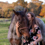 Girl loving on her senior horse.